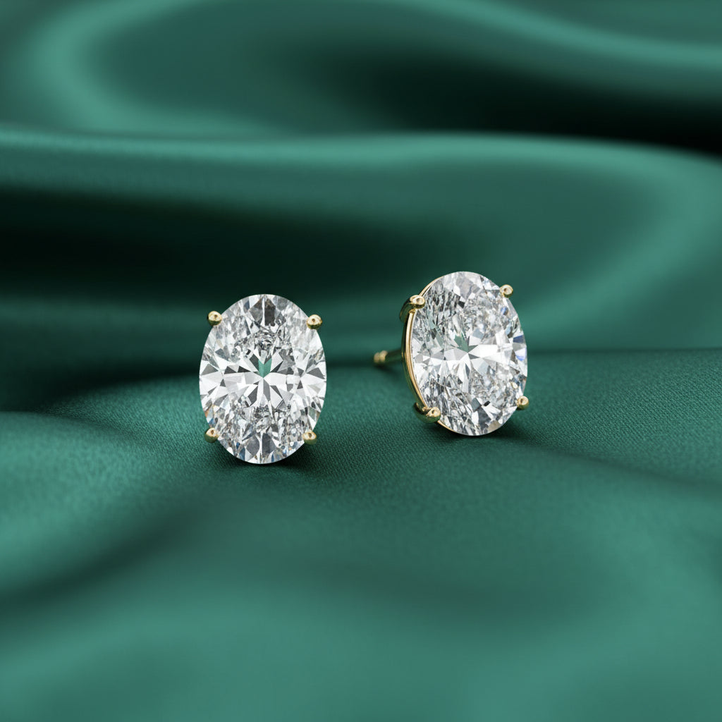 Pair of diamond stud earrings on a white background